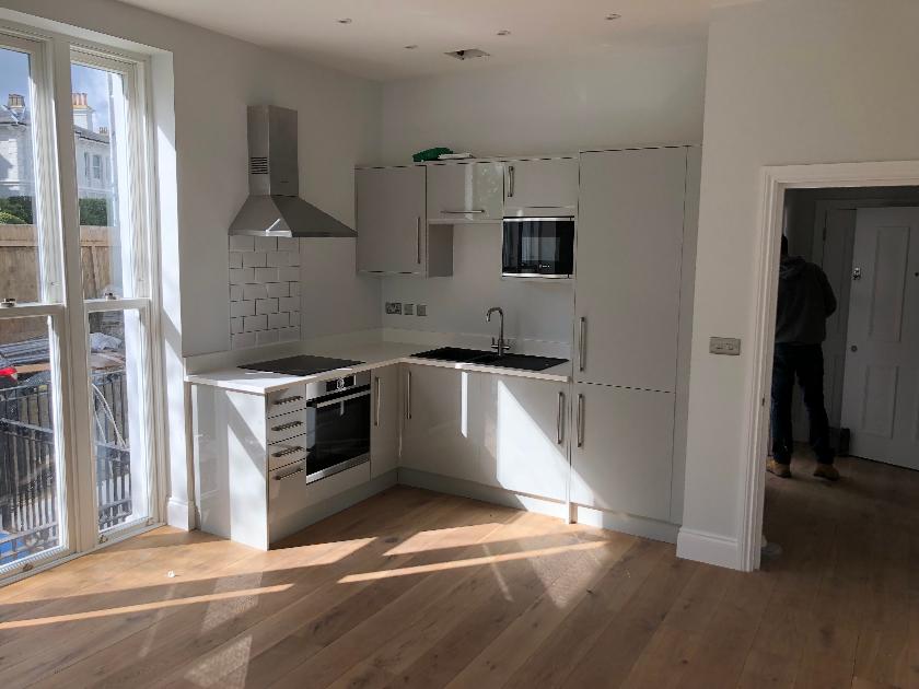 Modern fitted kitchen and timber flooring